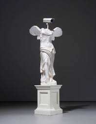 Banksy — CCTV Angel (2007) Artist: Banksy Title: CCTV Angel Year: 2007 Medium: Stencil and spray paint on wall (street art) Dimensions: Varies depending on the wall surface Location: Originally installed in public urban spaces in the United Kingdom