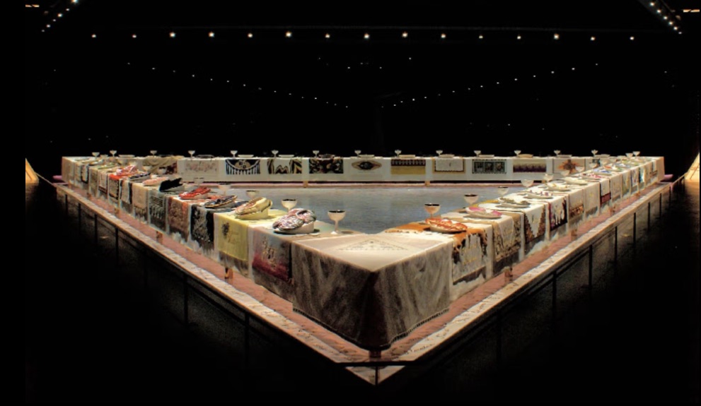 The Dinner Party, 1974–1979 Judy Chicago. Ceramic, porcelain, textile; triangular table, 576 x 576 in
