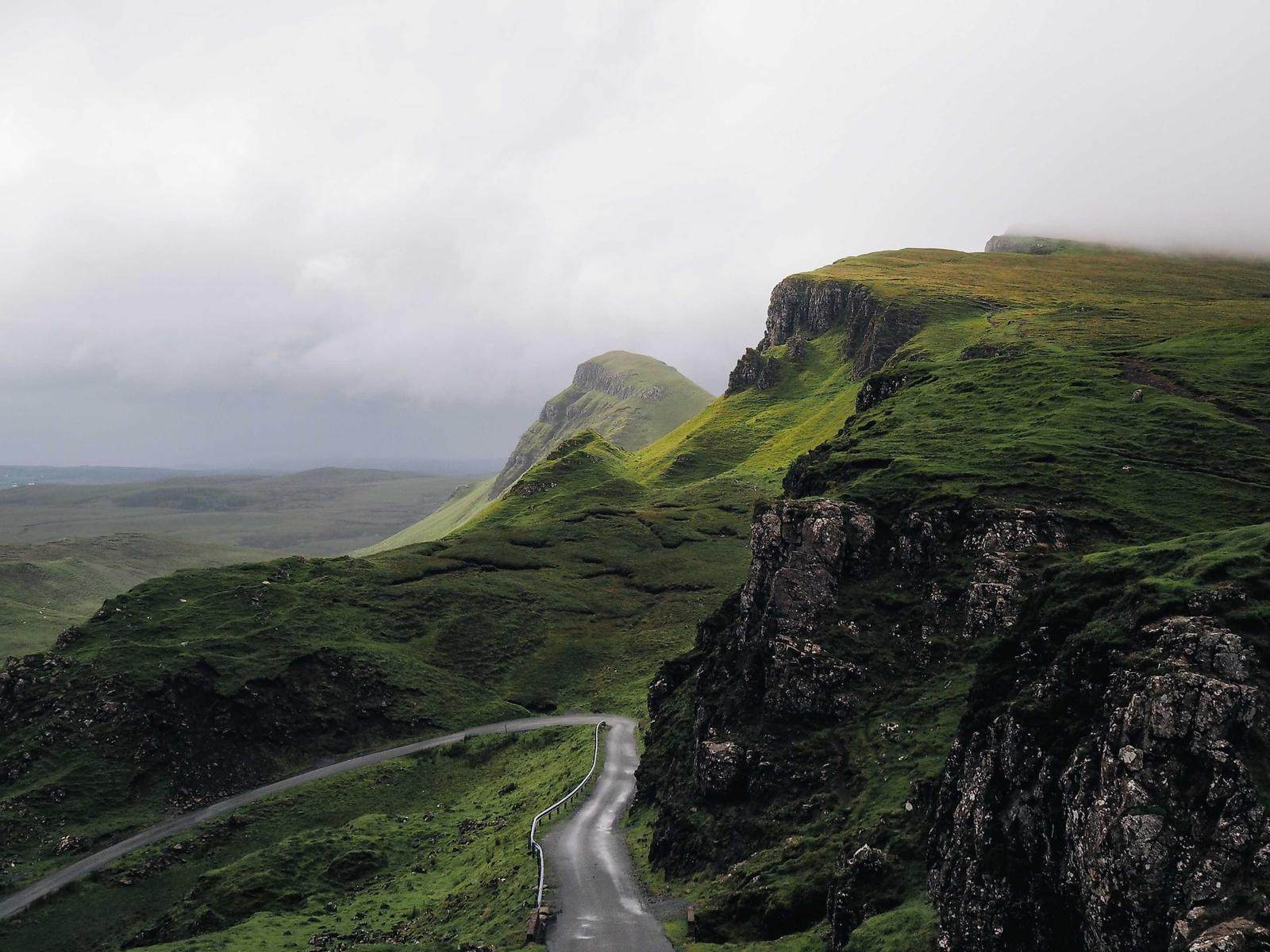 Green cliffs and road