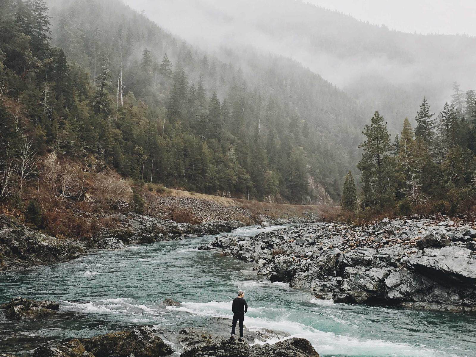 Figure by the rushing river